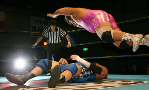 IWA Wrestling’s Mark Mercedes prepares to be body slammed by Japanese pro wrestler Yoshi, also known as the Pink Rhino. IWA Wrestling’s Mark Mercedes prepares to be body slammed by Japanese pro wrestler Yoshi, also known as the Pink Rhino.